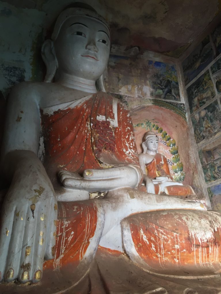 Orange robed, carved Buddha, Po Win Daung Caves, Monywa, Myanmar (Burma)