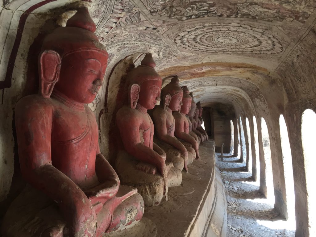 Carved red Buddhas, Po Win Daung Caves, Monywa, Myanmar (Burma)