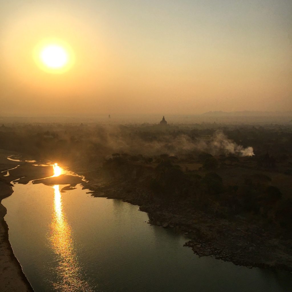 Sun rises and is reflected in the Irrawaddy River, Bagan, Myanmar