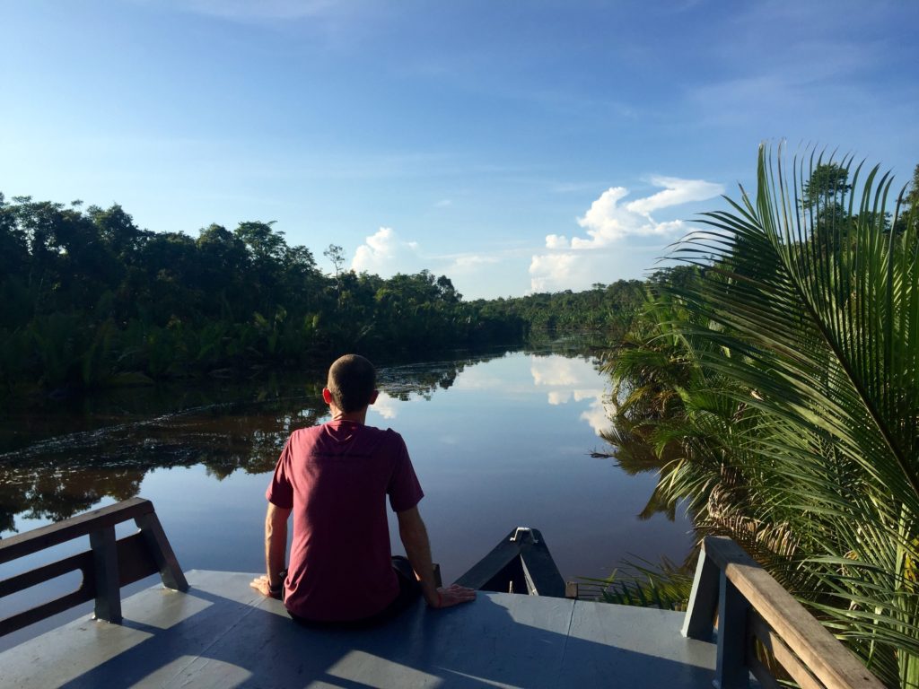 Sitting front of the klotok, Sekonyer River, Tanjung Puting National Park, Borneo (Kalimantan), Indonesia