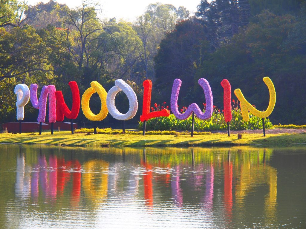Pyin Oo Lwin spelled out in brightly colored flowers in the middle of the lake