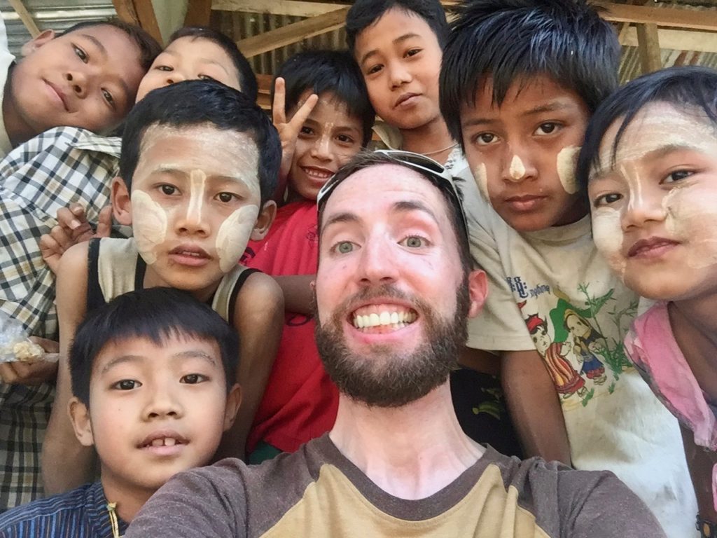 Eight young local kids and I posing for a group selfie