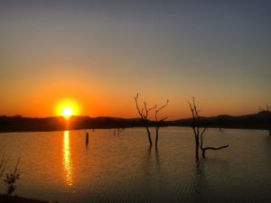 Sun setting over a lake in Kruger National Park
