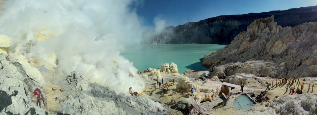 Sulphur mining on the shores of Kawah Ijen's turquoise acid lake