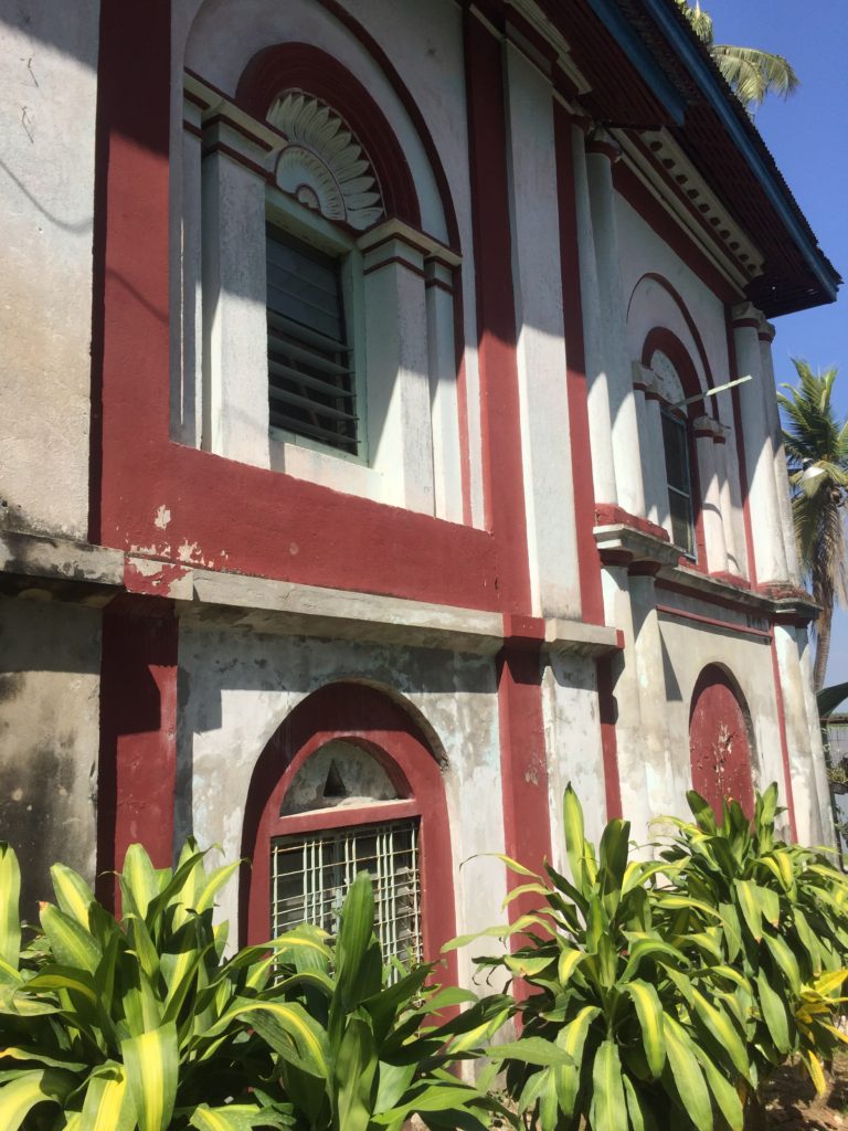 Red and white building with arched windows on Shampoo Island (Gaung Se Kyun)