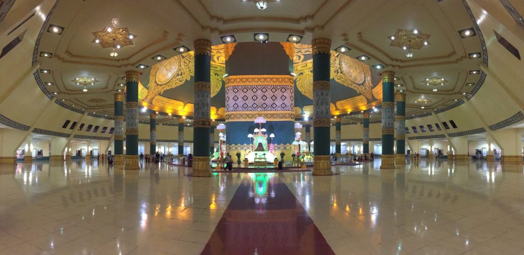 Wide angle panorama of the sparse white interior of Uppatasanti Pagoda
